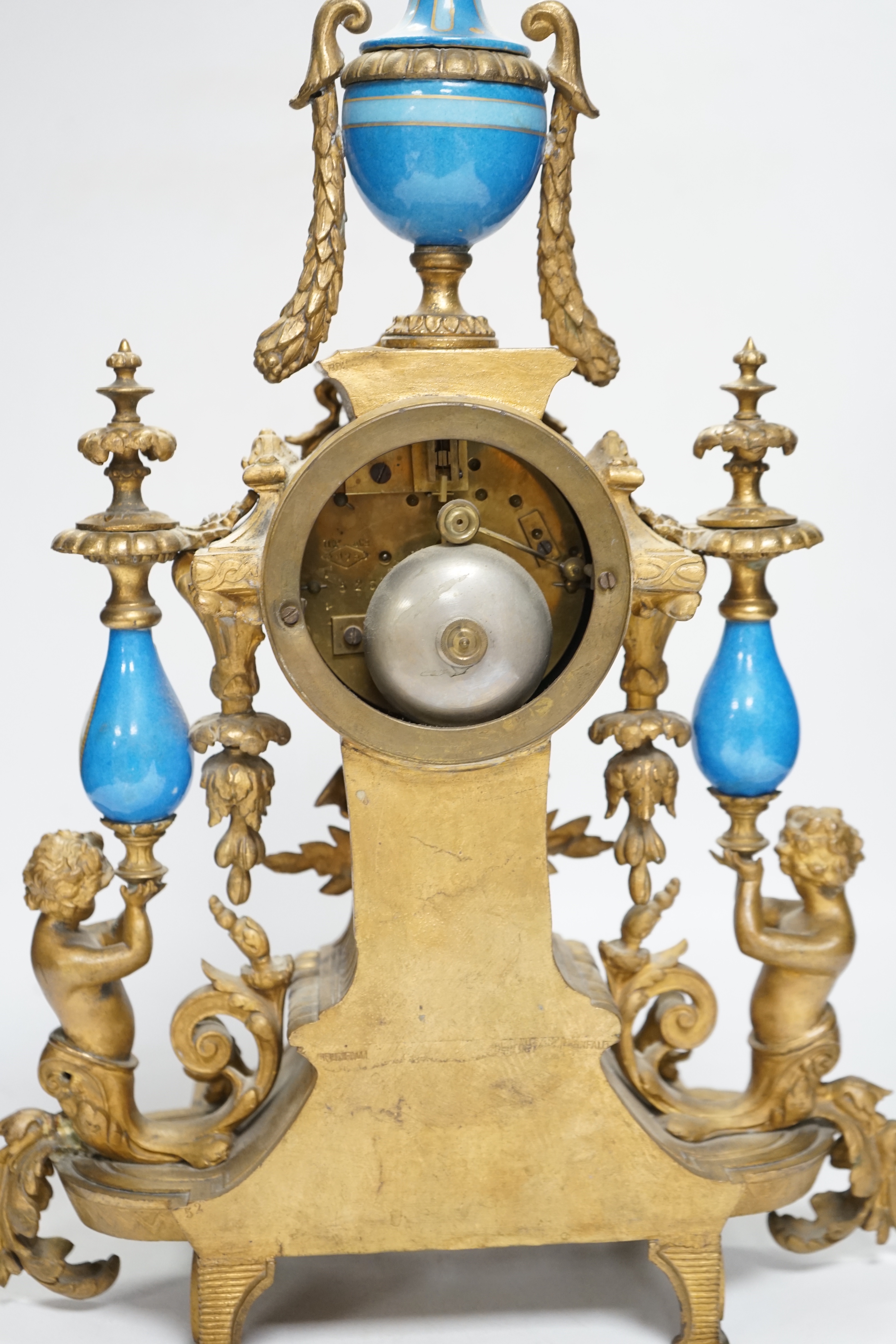 A Sevres style porcelain and gilt metal clock garniture, 44cm high